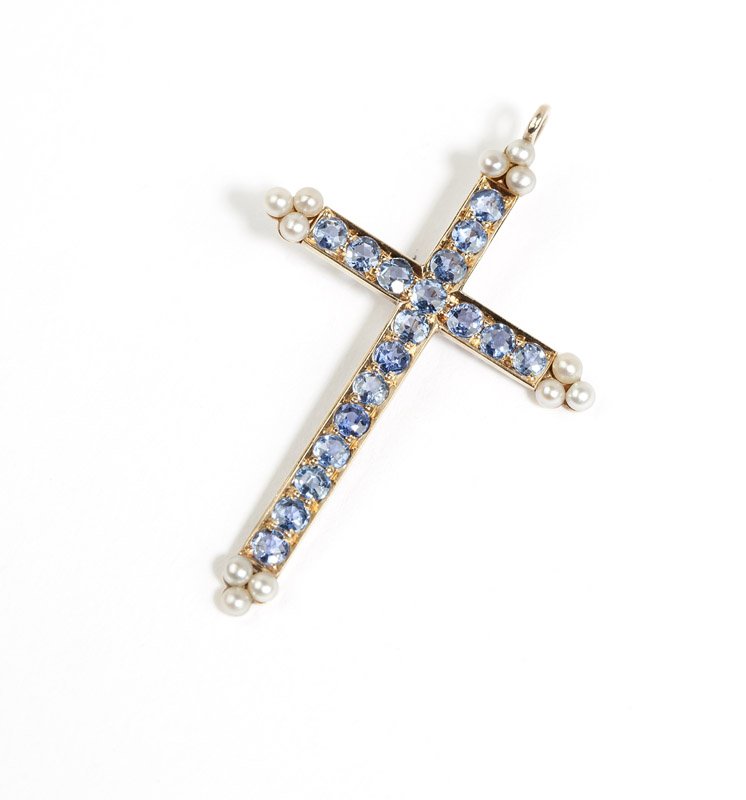 An antique sapphire cruciform enhancer