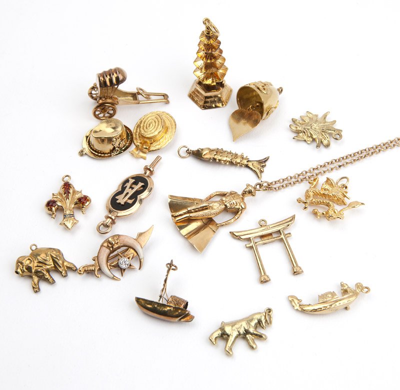 A collection of gold charms and one chain