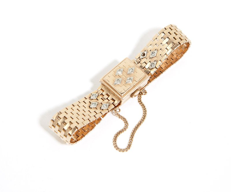 A retro 14K rose gold covered dial watch