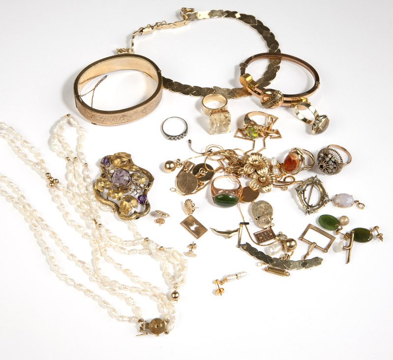 A collection of gold and gold filled jewelry