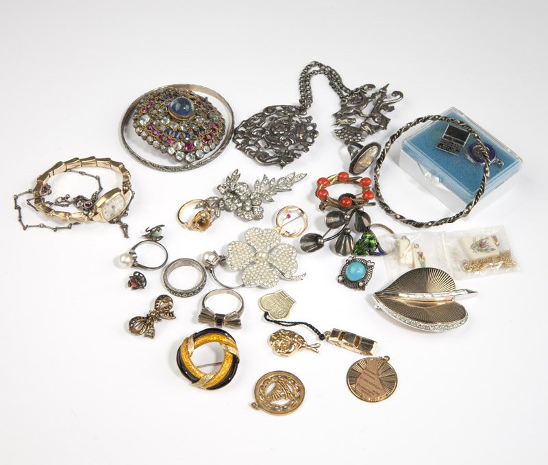 A collection of gold and costume jewelry