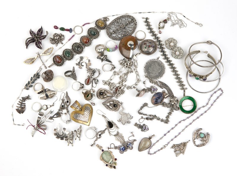 A collection of sterling jewelry and gemstones