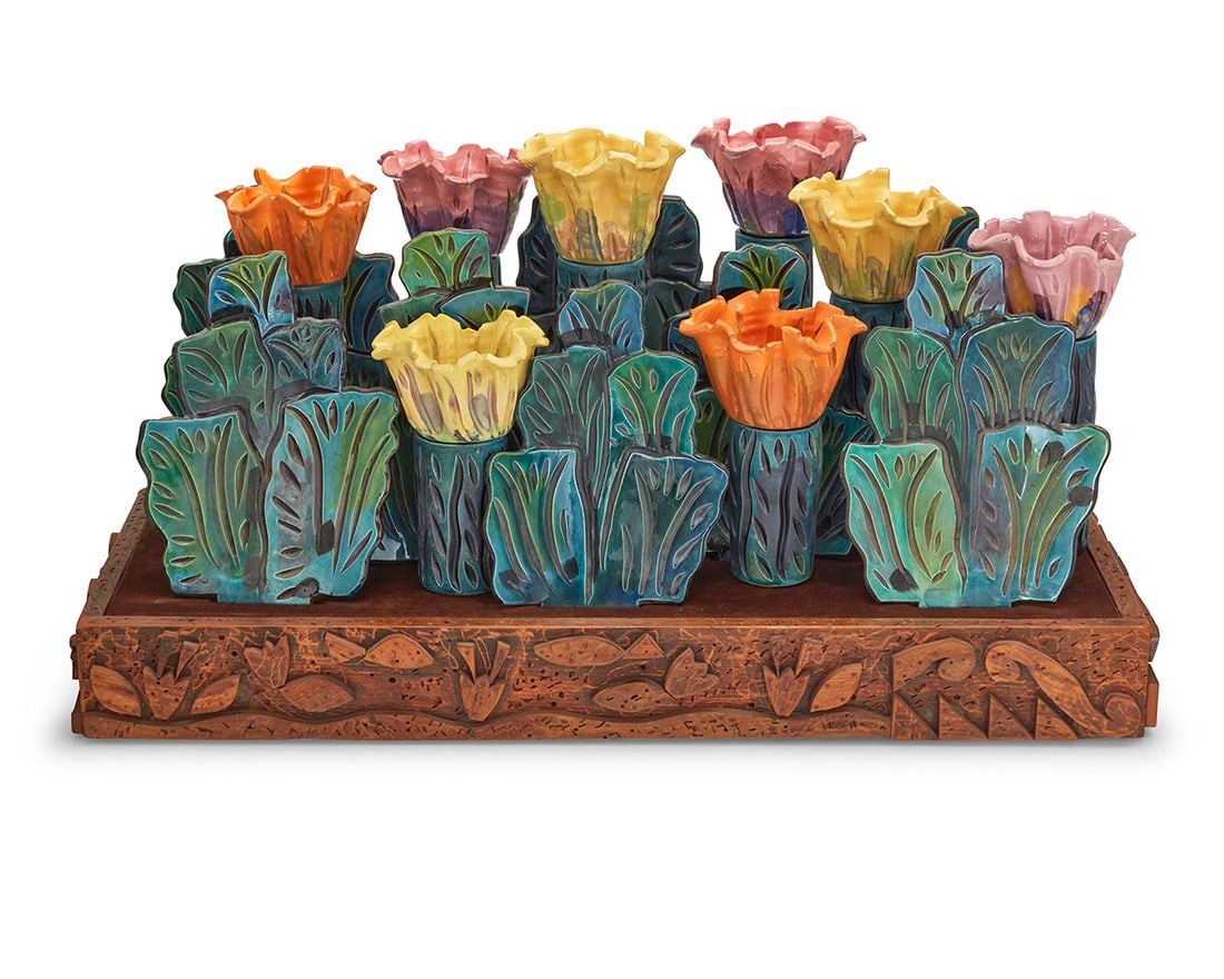 Eddie Dominguez (b. 1957), "Mixed Zinnias": Eddie Dominguez(b. 1957)"Mixed Zinnias"Glazed ceramic cups, plates, and bowls set in a carved wood baseMost cups and bowls marked for assemblyComprising 7 leaf-form plates, 8 floriform bowls, 16 cups,