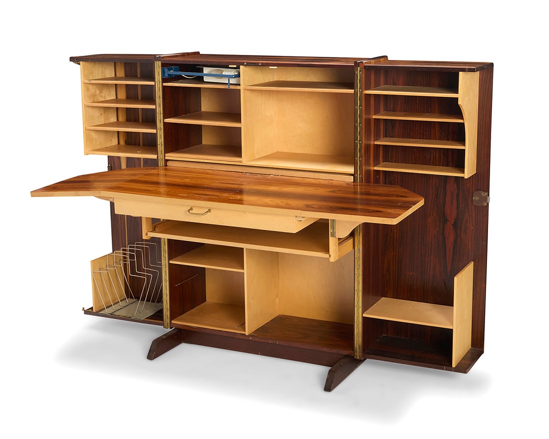 A Mummenthaler and Meier rosewood 'Magic Box Desk': Y A Mummenthaler and Meier rosewood 'Magic Box Desk'Mid-20th centuryAppears unmarkedWith two hinged sides opening to reveal an articulated desk lamp above a pull-out writing surface with hinged extens