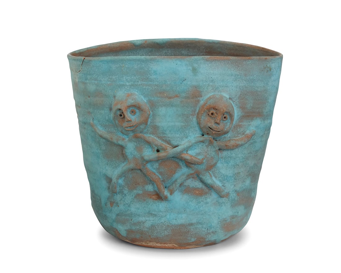 Beatrice Wood (1893-1998), A glazed earthenware bowl, mid-20th century: Beatrice Wood (1893-1998) A glazed earthenware bowl, mid-20th century Signed to underside: BEATO; later numbered, likely in another hand: 282 Each side with two figures in relief 6.125" H x 6.875" W