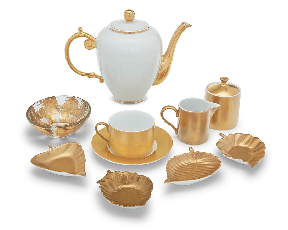 A Contemporary assembled parcel gilt porcelain tea service: A Contemporary assembled parcel gilt porcelain tea service Late 20th century Each with printed factory marks Comprising: Marc Blackwell 'Florentine': 16 teacups (2.375" H) 16 saucers (6.25") 2 sugars