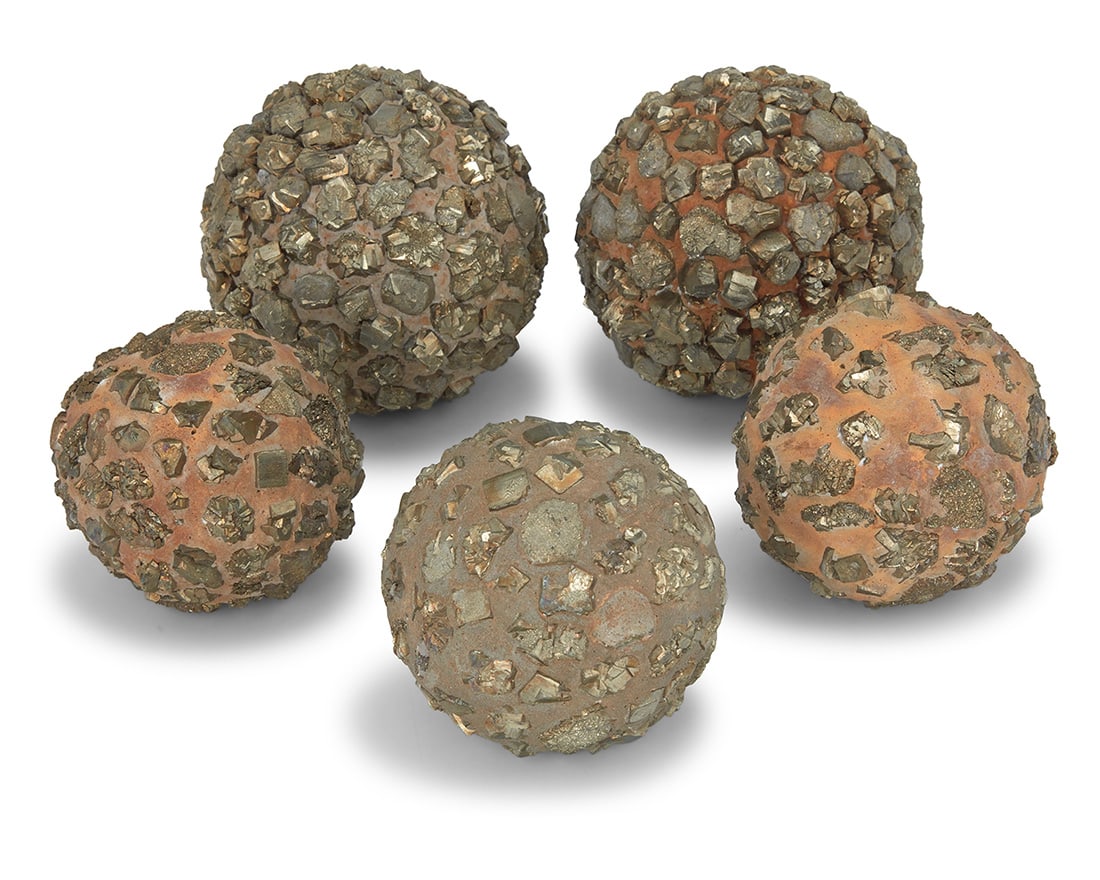 Five pyrite specimen spheres: Five pyrite specimen spheres 20th century Each fool's gold nugget set into a concrete matrix 5 pieces Largest: 5.375" Dia.; Smallest: 4" Dia. Provenance: The Estate of Elaine Wynn