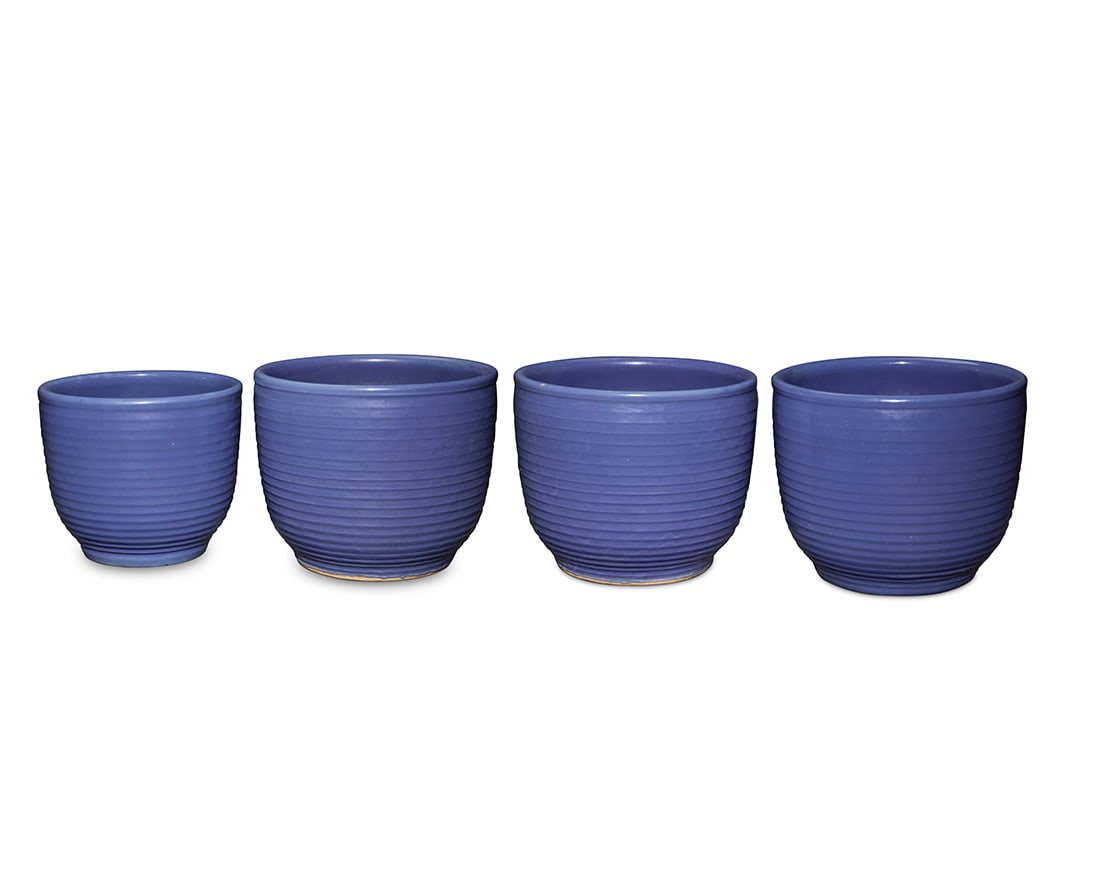 Four Bauer blue glazed pottery ringware planters: Four Bauer blue glazed pottery ringware plantersCirca 1930sEach unmarked4 piecesThree: 13.125" H x 16.375" Dia.; One smaller: 12.25" H x 14.125" Dia.