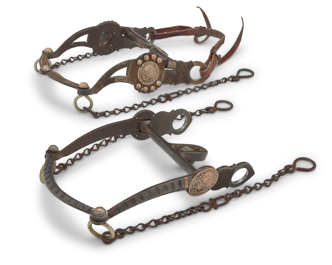 Two Les Vogt mixed metal parade style horse bits: Two Les Vogt mixed metal parade style horse bitsLate 20th/21st centuryEach stamped: Les Vogt's / Flat Creek / [Model no]Comprising two ornate bits in mixed metal and sterling silver, one with extensiv