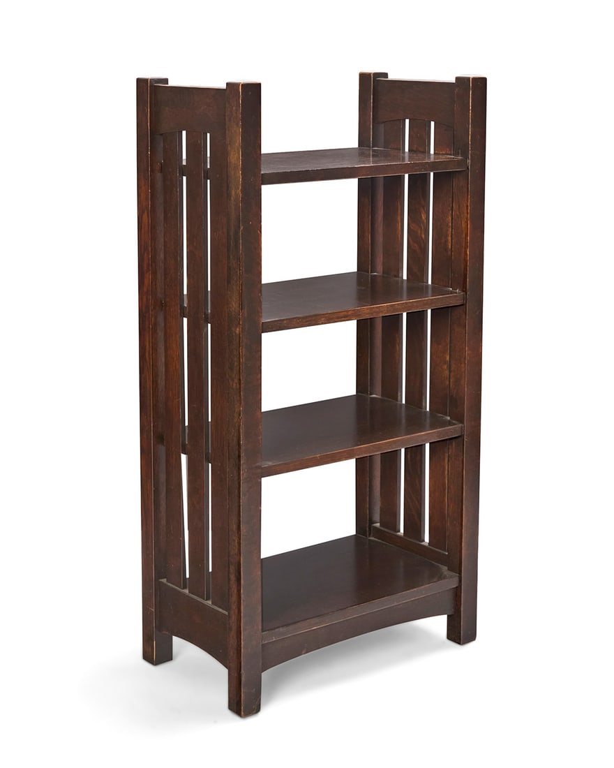 An L. & J. G. Stickley Onondaga magazine stand: An L. & J. G. Stickley Onondaga magazine stand 1906-1912; Fayetteville, NY With partial red label: L. & J.G. STICKLEY / HANDCRAFT With four tiers and slatted sides 40.25" H x 21" W x 12" D 