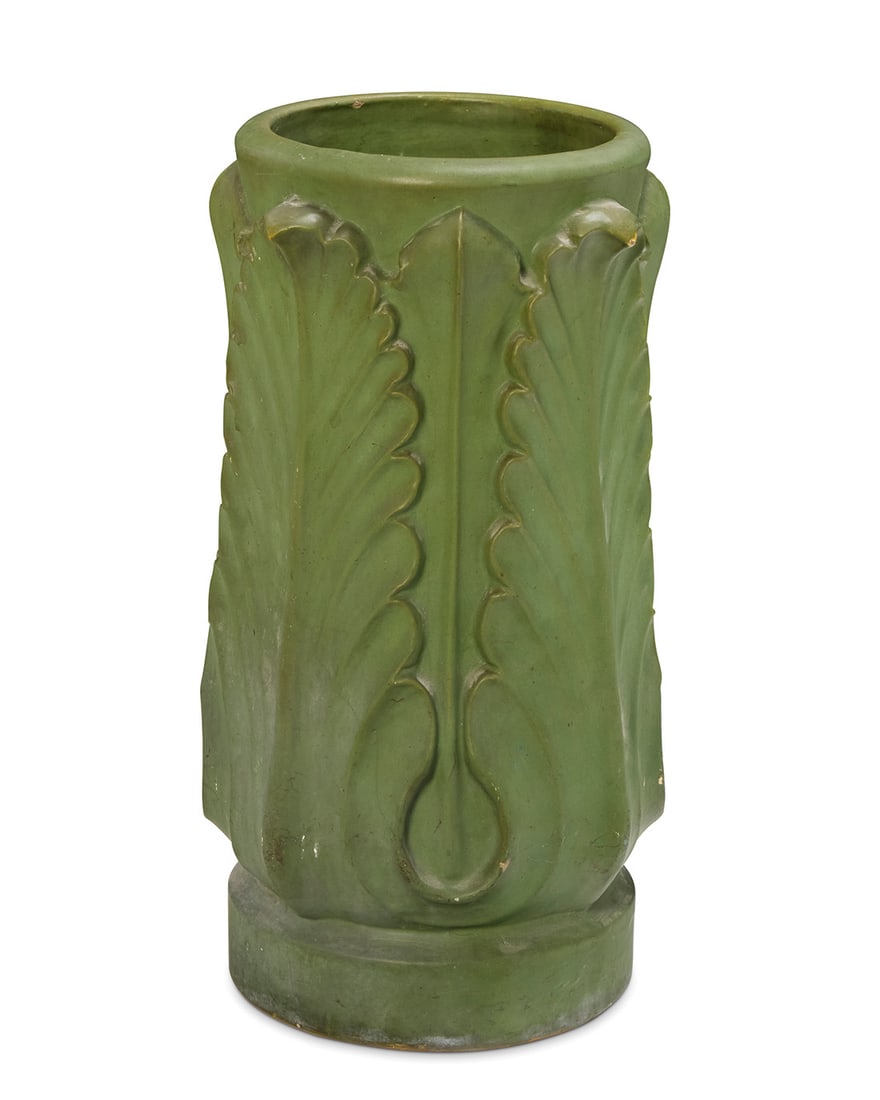 A Rookwood faience umbrella stand: A Rookwood faience umbrella stand1907Marked for Rookwood and dated; further impressed: 1115 / 48 /.A.Y.The stand with large leaves in relief and a green matte glaze26.25" H x 14.5" Dia. Provenance:The