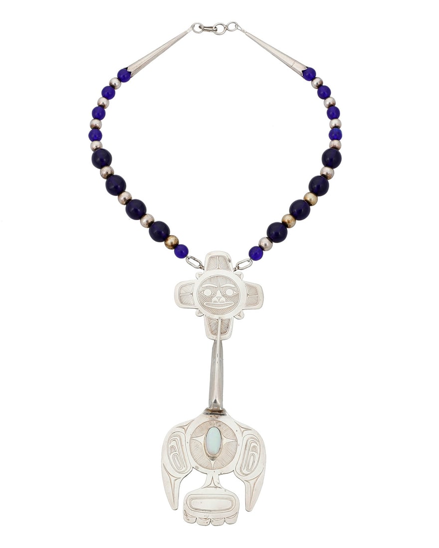 Barry Lorne Wilson (b. 1952, Haisla), "Raven Carries the Light," 1990: Barry Lorne Wilson (b. 1952, Haisla) "Raven Carries the Light," 1990 A Haisla sterling silver and gemstone necklace Marked verso: BLW [conjoined] With elaborate incised sterling silver Northwest