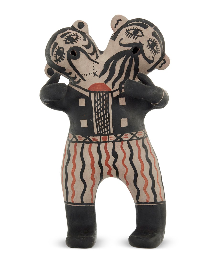 Mary Janice Ortiz (b. 1954, Cochiti Pueblo), A polychrome pottery double headed figure, late: Mary Janice Ortiz (b. 1954, Cochiti Pueblo) A polychrome pottery double headed figure, late 20th/early 21st century Partial indecipherable marks to underside of feet Decorated in black and orange on