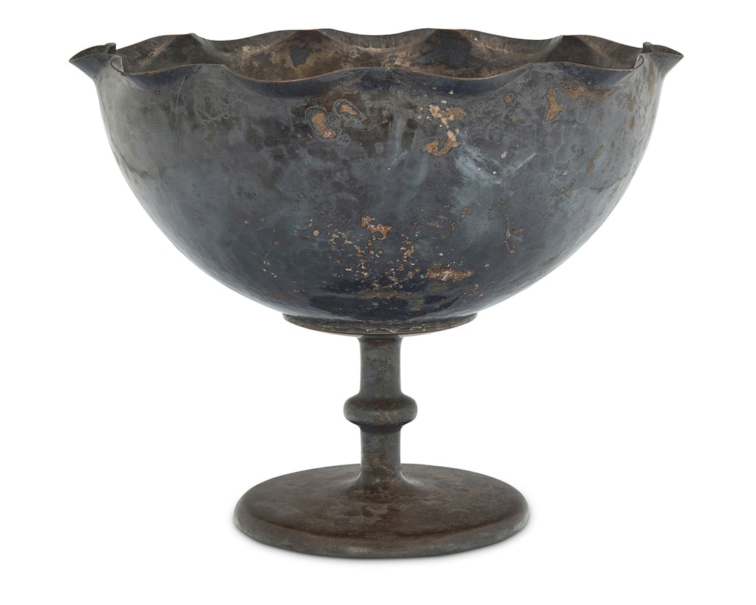 An Arts & Crafts silvered hammered copper bowl: An Arts & Crafts silvered hammered copper bowl Early 20th century Unmarked The footed bowl with piecrust rim 9.75" H x 12" Dia. Provenance: The Collection of Gary Diamond, Los Angeles, CA
