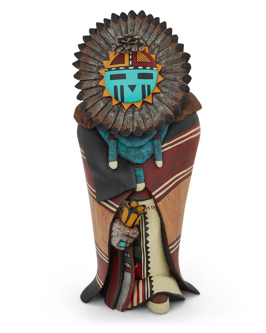 Gerry Quotskuyva (b. 1959, Hopi-Tewa), A painted carved cottonwood 'Sunface' katsina, 2012: Gerry Quotskuyva (b. 1959, Hopi-Tewa)A painted carved cottonwood 'Sunface' katsina, 2012With incised signature, date, and title to underside: Quotskuyva / '12[Tawa], depicted with feathers centering t