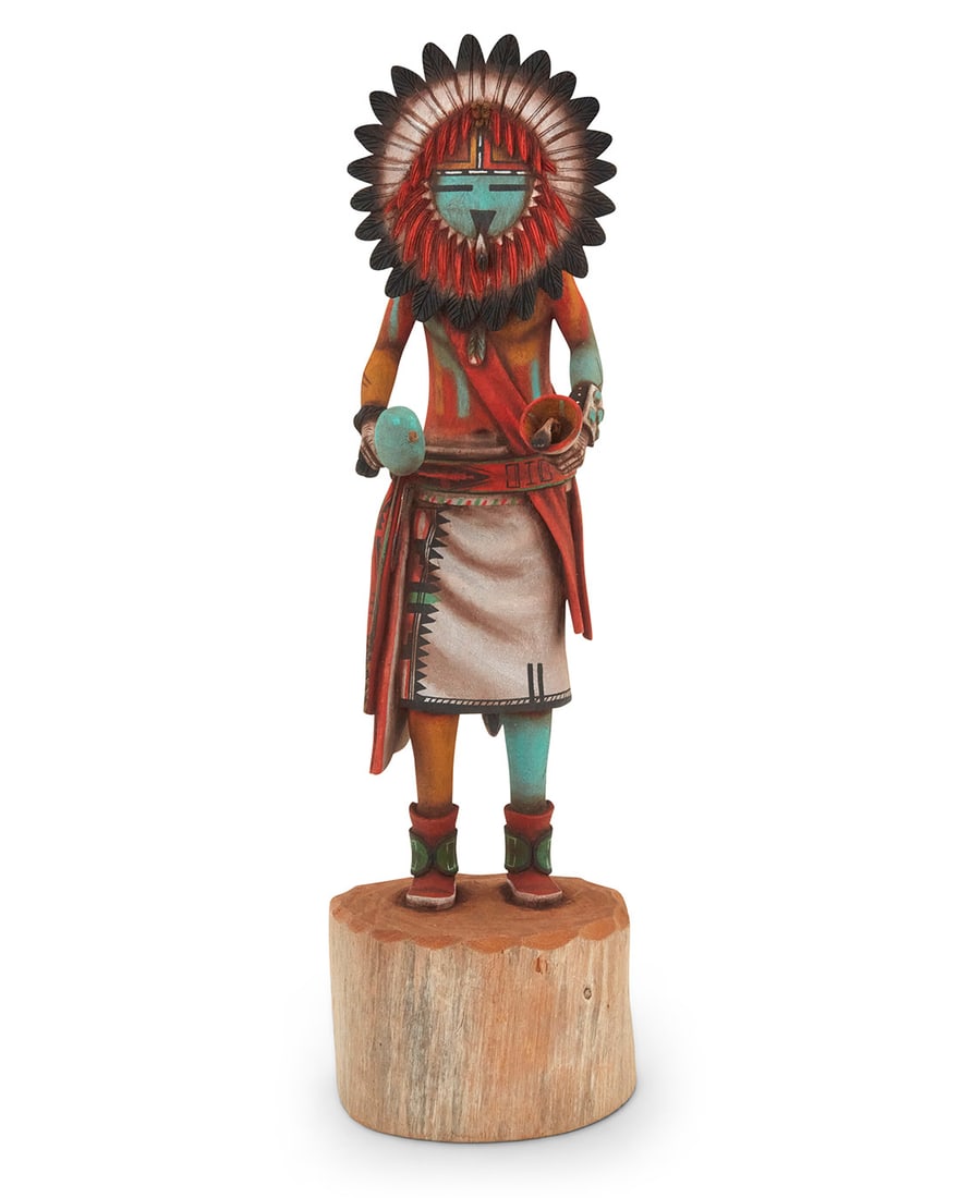 Jonathan Day Sr. (Laguna Pueblo/Hopi-Tewa), A painted carved cottonwood 'Tawa' Sunface katsina, 1993: Jonathan Day Sr. (Laguna Pueblo/Hopi-Tewa) A painted carved cottonwood 'Tawa' Sunface katsina, 1993 Signed and dated to underside: Jonathan Day / "93" Depicted with rattles Overall: 13.5" H x 3.875"