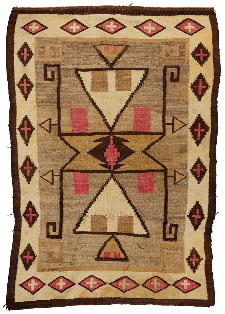 A Navajo Storm Pattern rug: A Navajo Storm Pattern rugEarly 20th century, DineWoven in dark brown, red, ochre, tan, and natural grey/brown, the border with floating crosses within stepped and smooth diamonds69.5" H x 48" W