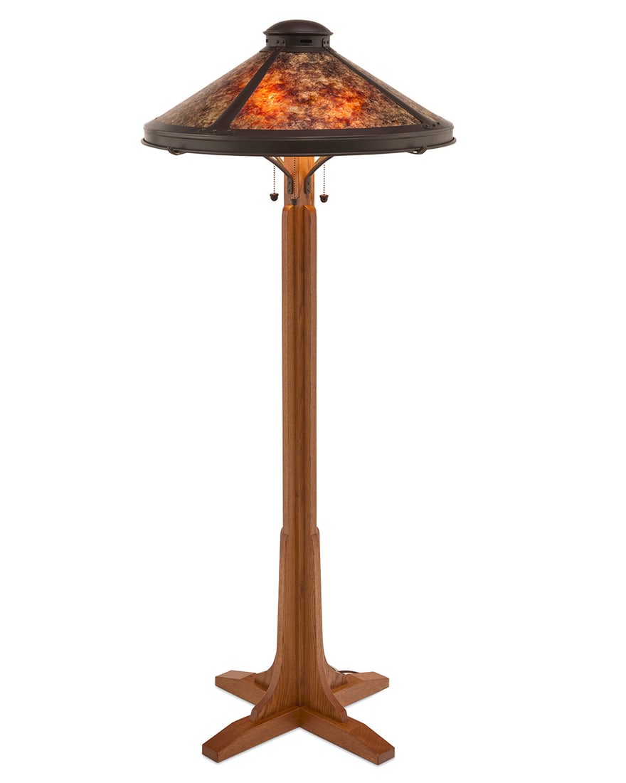 A Mica Lamp Co. Arts & Crafts style floor lamp: A Mica Lamp Co. Arts & Crafts style floor lampEarly 21st centuryShade with applied label: MICA LAMP CO. / Glendora, CA / SOLID COPPER; with factory burn mark to underside of baseThe wood standard on a