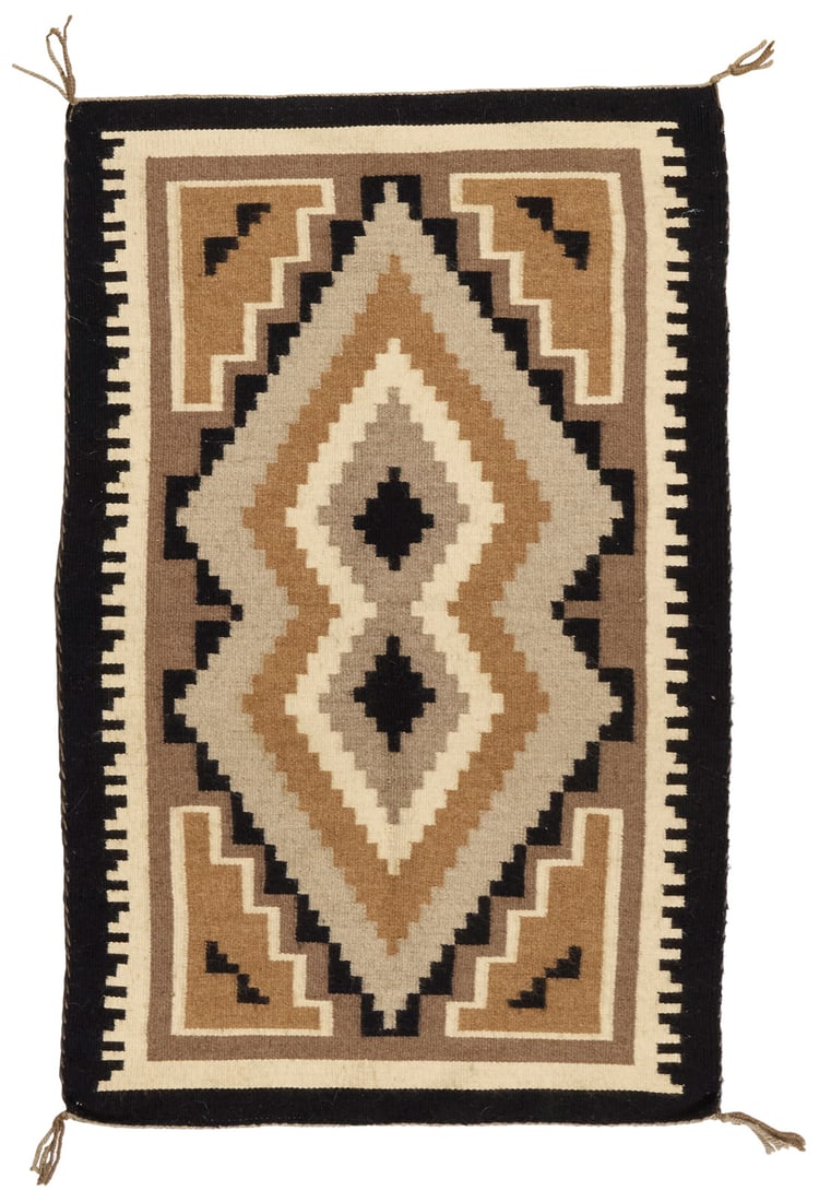 A Navajo Two Grey Hills textile: A Navajo Two Grey Hills textile Mid/late 20th century, Dine Attributed to Margret Lewis A small tapestry-woven textile woven in tan, light and mid grey, light brown, black and cream wool with central