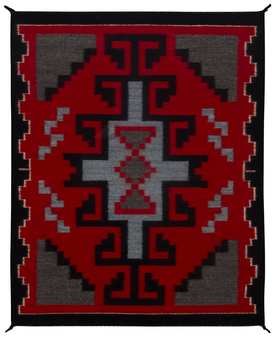 A framed Rena Billie Navajo Ganado textile: A framed Rena Billie Navajo Ganado textile Rena Billie (b. 20th century, Dine) Circa 1987, Lower Greasewood, AZ A small mat woven in red, grey, and black wool with central hooked diamond and