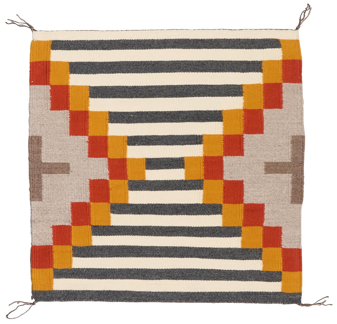 A Dwight Laughing Williams Navajo revival saddle blanket textile: A Dwight Laughing Williams Navajo revival saddle blanket textile Dwight Laughing Williams (b. 20th century, Dine) Woven in cream, grey, orange, red, and black wool with striped banding and partial