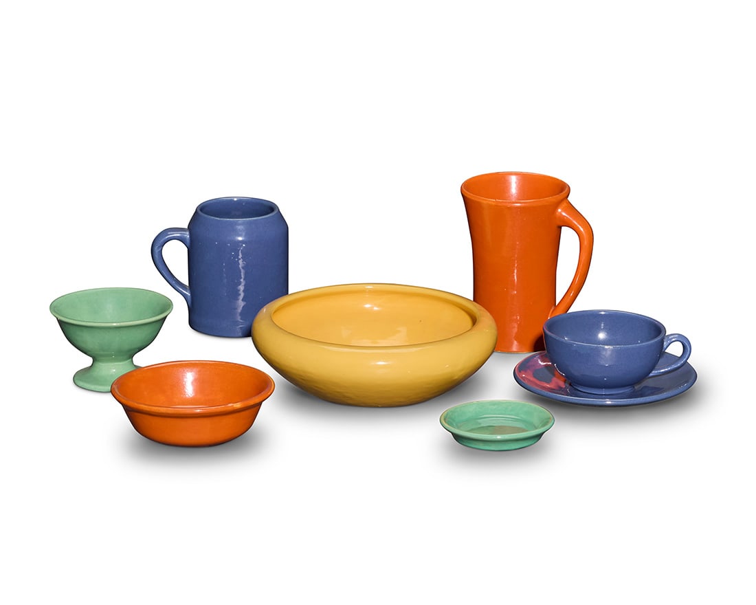 A collection of Bauer glazed pottery table items: A collection of Bauer glazed pottery table itemsCirca 1930sEach unmarkedComprising:8 dinner plates7 partitioned plates7 salad plates7 bread & butter plates3 serving plates3 large bowls