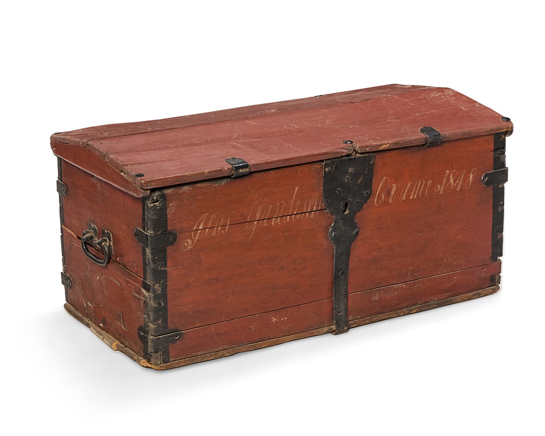 A Northern European painted wood immigrant chest: A Northern European painted wood immigrant chest Circa mid-19th century Inscribed indistinctly and dated 1848 With enameled metal latch lock, opposed handles, hinges, and corner brackets 18.75" H x