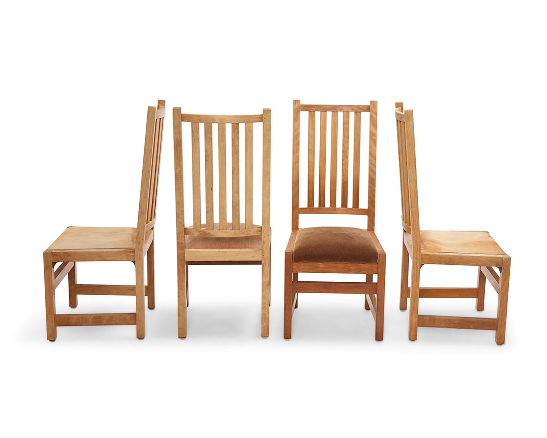 A set of four Arts & Crafts style oak spindled side chairs: A set of four Arts & Crafts style oak spindled side chairs Mid/late 20th century Each unmarked Comprising two with leather seat and two with mohair seat, each with five spindle back 4 pieces Each: