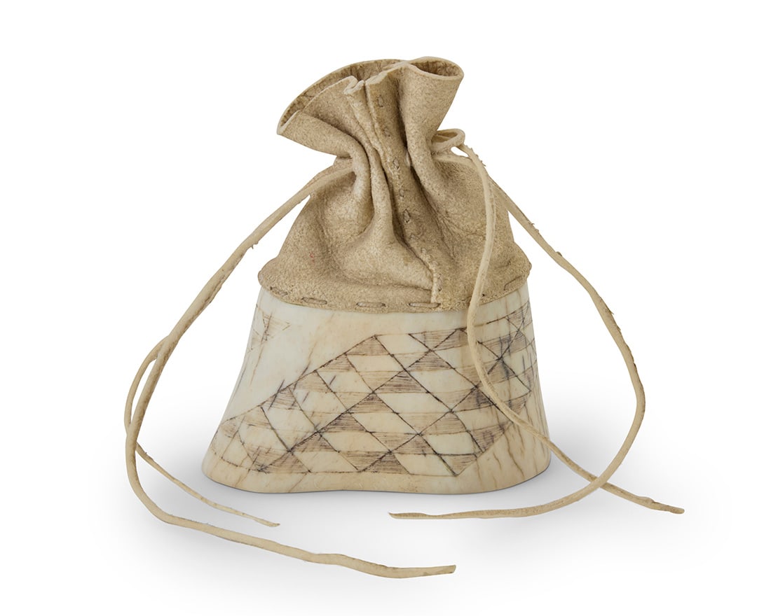 George Blake (b. 1944, Hupa-Yurok), A small carved elk antler freestanding bag, circa 1995-1996: George Blake (b. 1944, Hupa-Yurok) A small carved elk antler freestanding bag, circa 1995-1996 Etched to lower edges on each side: G BLAKE / 3.96 With carved base featuring angled rows of diamond