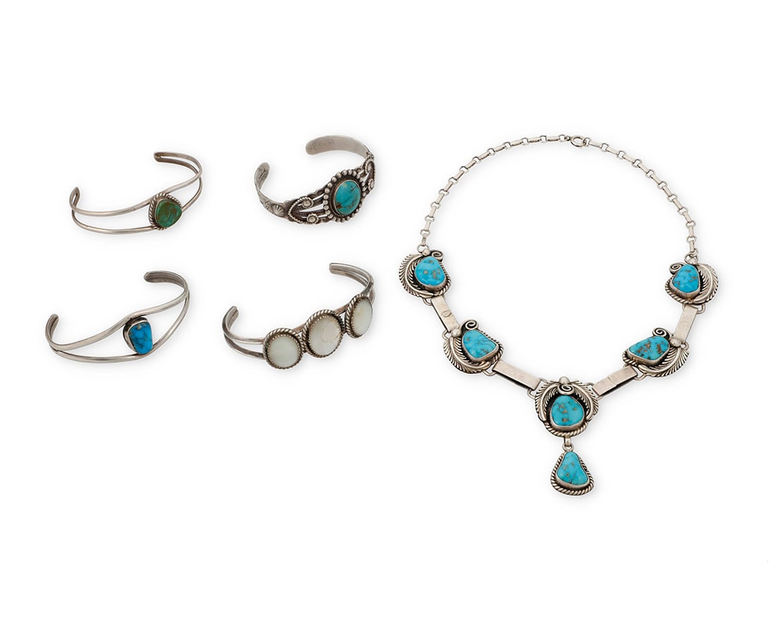 A group of Southwest silver jewelry: A group of Southwest silver jewelry Mid/late 20th century Five works: Jack & Mary Tom (b. 1948 & b. 20th century, Dine) A Navajo sterling silver and turquoise necklace Stamped: JT / Sterling / IHMJ