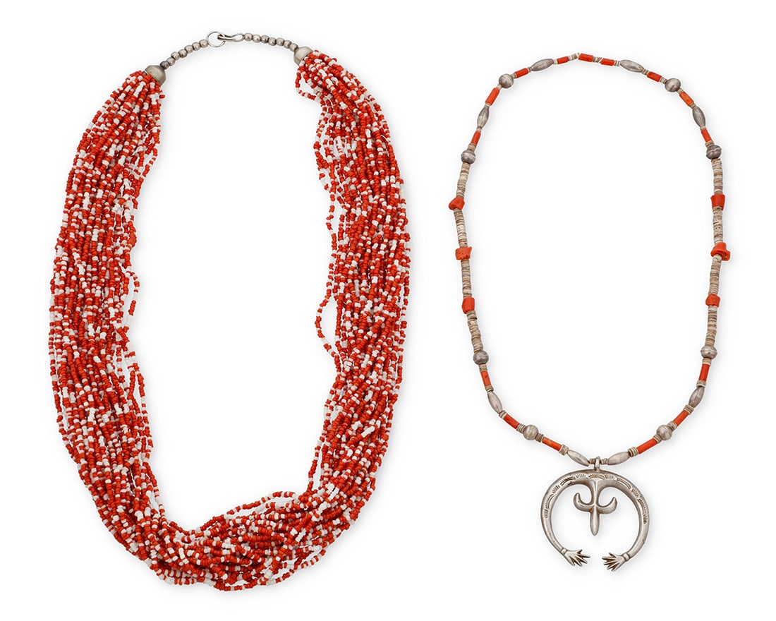 Two Southwest necklaces: Two Southwest necklaces Mid/late 20th century Comprising a sandcast sterling silver naja suspended by a single strand of coral, heishi, and silver beads (24" L x 2.375" H), as well as a multistrand