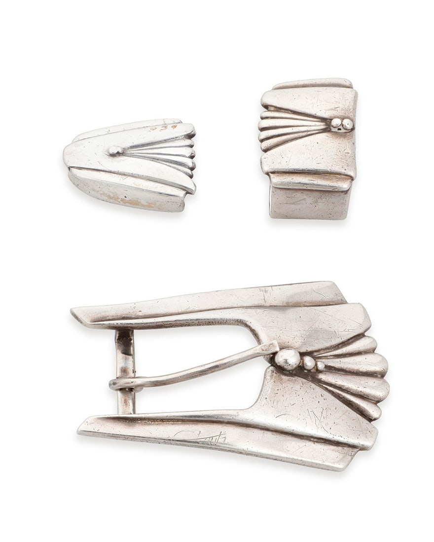 A David Dear 'Fritz" Southwest sterling silver ranger set: A David Dear 'Fritz" Southwest sterling silver ranger set Late 20th century Buckle stamped: DEAR / .925 / © A 'Fritz' Art Deco-style set comprising a sterling silver buckle, one keeper, and a tip,