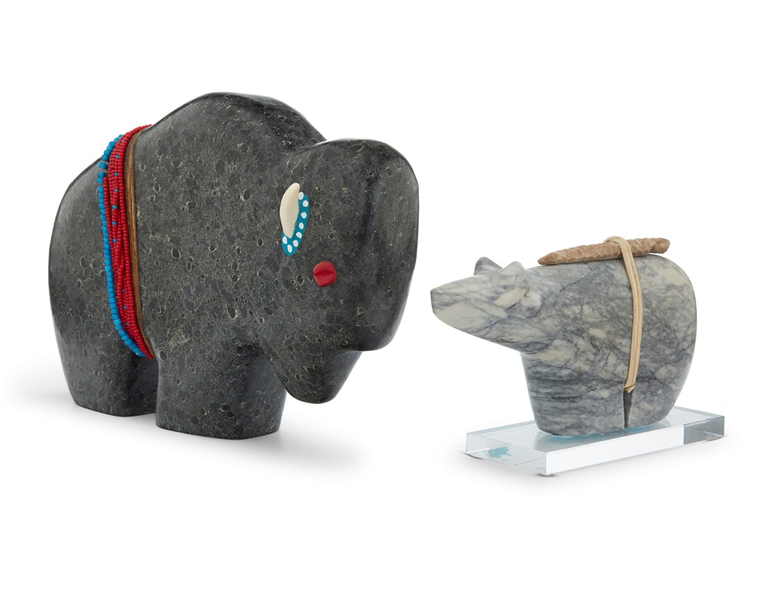 Two Zuni carved hardstone fetish animals: Two Zuni carved hardstone fetish animalsLate 20th centuryBuffalo with incised signature: RiverwomanComprising a buffalo figure titled "Woman of the Buffalo" by Riverwoman Freesoul, mounted with bone h