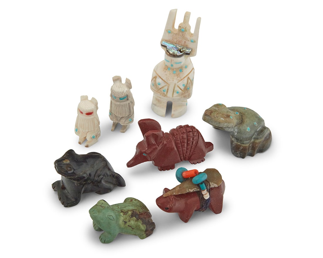 A group of Southwest Zuni carved stone animal fetishes: A group of Southwest Zuni carved stone animal fetishesMid/late 20th centuryOne small antler figure marked: HLComprising two carved greenstone frogs, a carved catlinite pipestone armadillo, and a carve