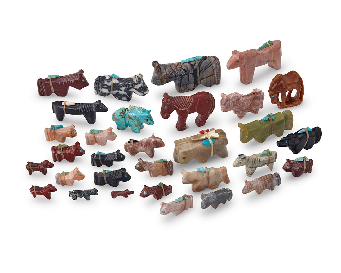 A group of Southwest Pueblo carved stone horse fetish figures: A group of Southwest Pueblo carved stone horse fetish figuresMid/late 20th century, mostly Zuni PuebloOne marked to base, twelve labeled for artistA large group of carved stone figures, primarily hors