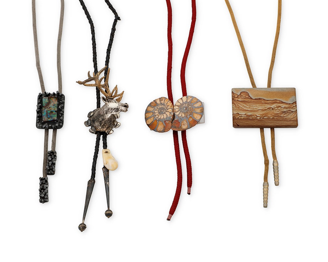 A group of Southwest style bolo ties: A group of Southwest style bolo tiesLate 20th centuryEach unmarkedFour works comprising a rectangular picture jasper bolo tie on a gold-tone mesh cord with metal tips (34.5" L), and a fossilized doubl