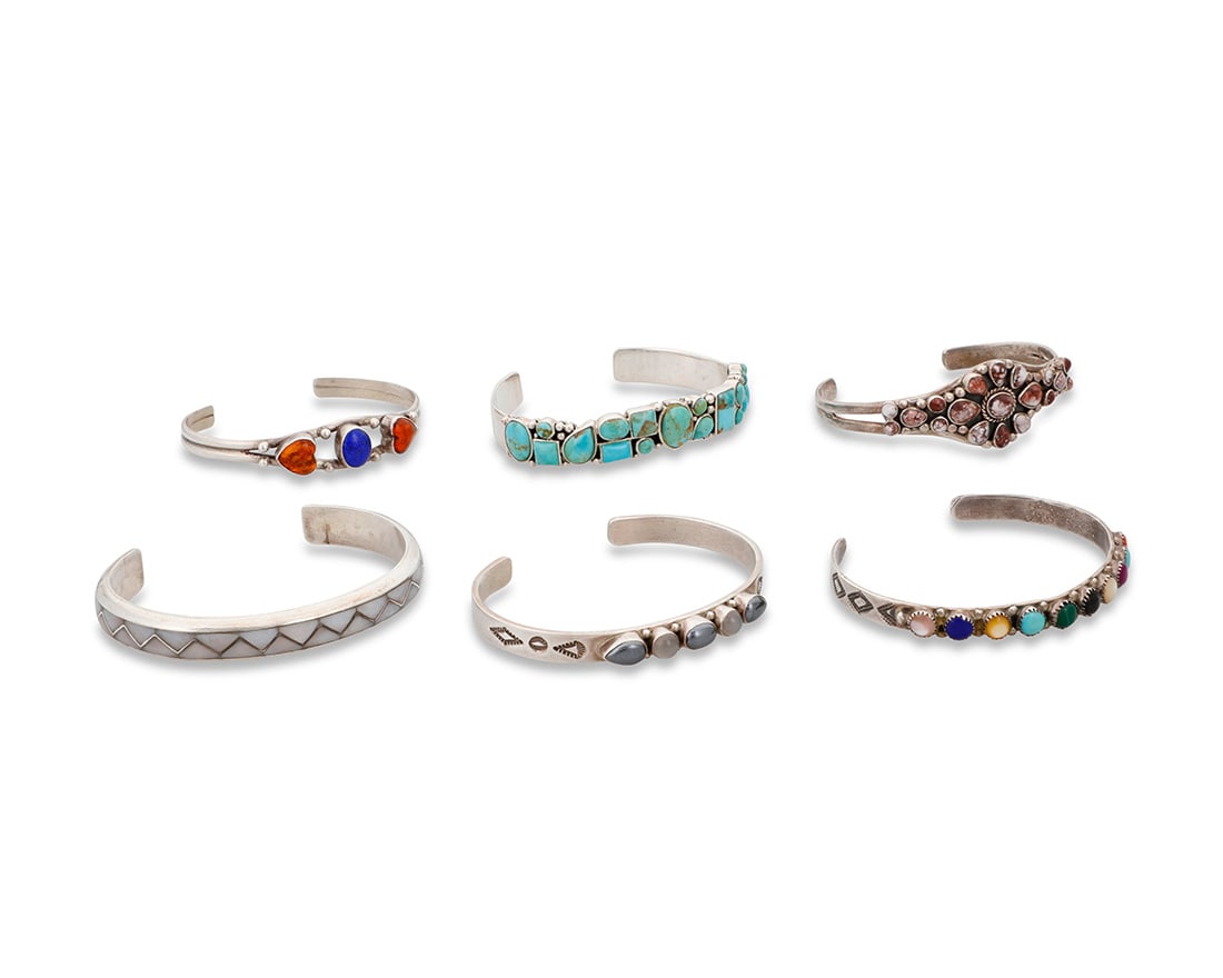 A group of Southwest style stone set cuff bracelets (1 of 8)