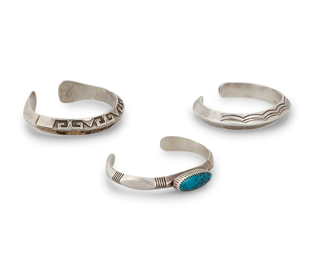 A group of Southwest cast silver cuff bracelets (1 of 4)