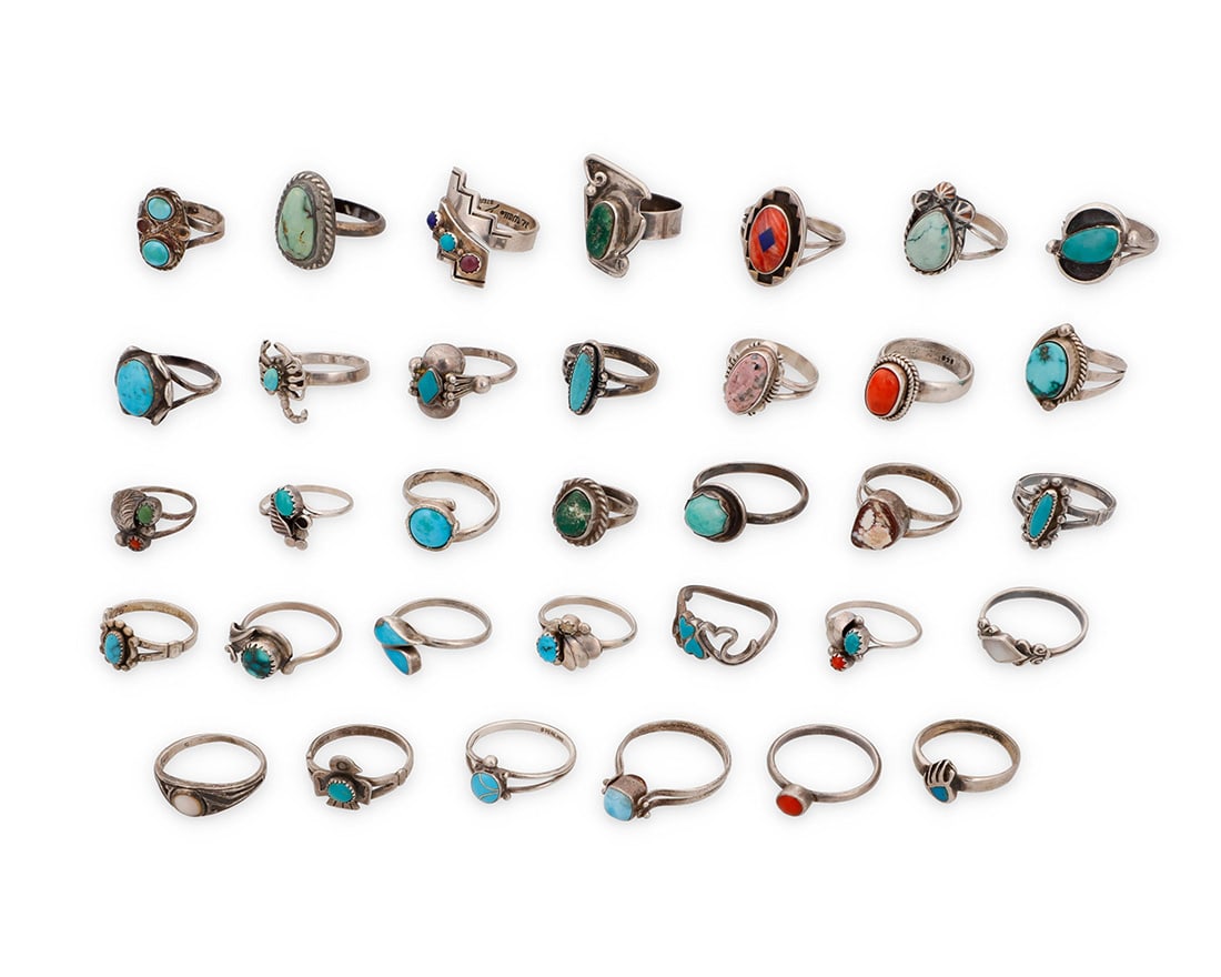 A large group of Southwest style silver and stone set rings: A large group of Southwest style silver and stone set ringsMid/late 20th centurySixteen variously marked for maker and/or for sterling: B / OTT © / Teme [Sunburst Handcrafts] / [Bell Trading Post] /