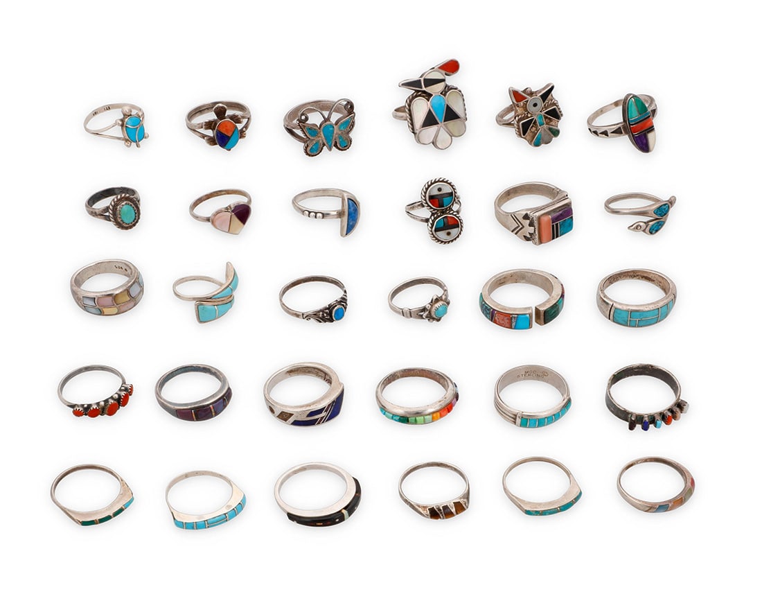 A group of Southwest silver and stone inlay rings: A group of Southwest silver and stone inlay ringsMid/late 20th centuryMost variously marked for maker and/or for sterling: CLY / MGD / TSI / K / TSP / JCSC S-10 / SS T / Teme [for Sunburst Handcrafts