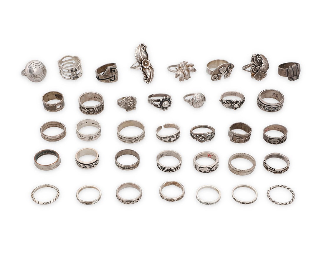 A group of Southwest-style silver rings: A group of Southwest-style silver ringsMid/late 20th centuryMost variously marked for maker and/or for sterling: LL BCT [Lloyd Becenti, Navajo/Dine] / L. Chee Navajo / S [Shube's] / Mexico / Masha / V