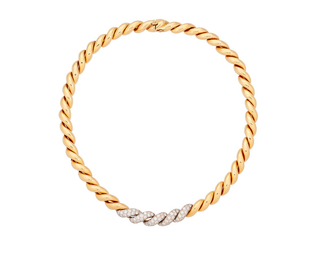 Van Cleef & Arpels: An 18K Bi-Color Gold and Diamond Necklace: Van Cleef & Arpels: An 18K Bi-Color Gold and Diamond NecklaceOf a twisted link design featuring pave-set diamonds weighing approximately 2.50 carats, signed VCALength: 14 1/4 in.47.6 grams gross