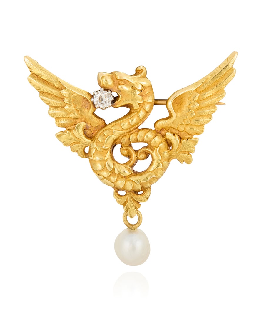 An Art Nouveau 20K Gold, Pearl and Diamond Brooch: An Art Nouveau 20K Gold, Pearl and Diamond Brooch Of a griffin design carrying a singular old mine-cut diamond suspending a natural saltwater pearl element, c. 1900 Measures: 1 7/8 x 1 3/4 in. 17.1