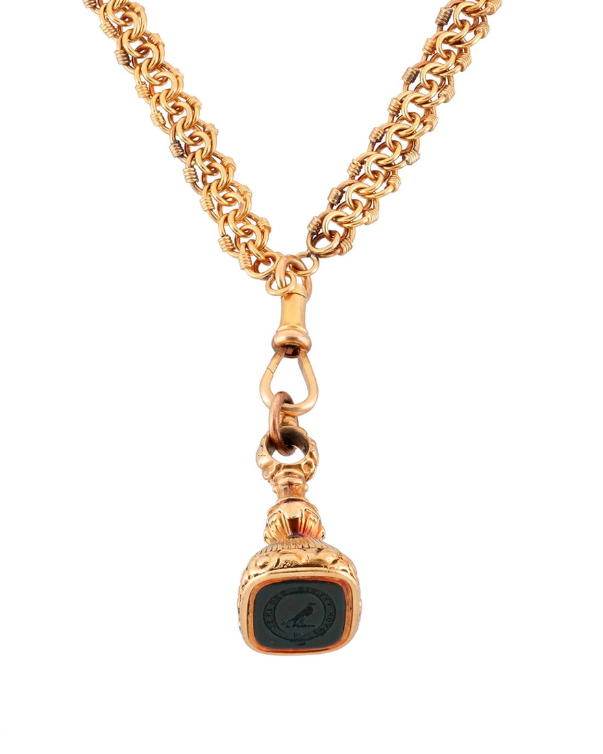 A Gold Chain and Fob Necklace: A Gold Chain and Fob Necklace Featuring a 14k gold fob set with a bloodstone intaglio stating "Non Verbis Sed In Re", suspended from an extra-long 20k gold fancy link chain Fob: 2 1/4 x 3/4 in.,