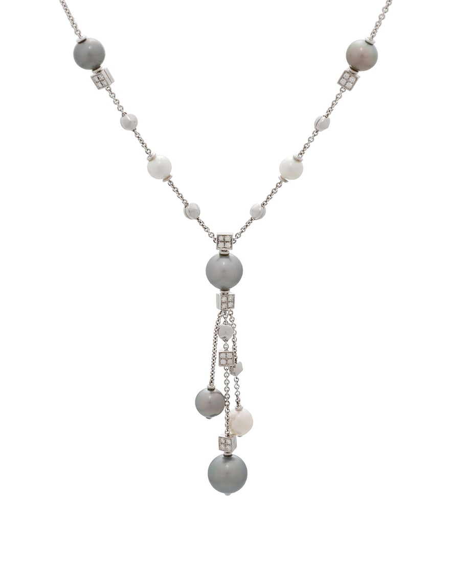 Bulgari: An 18K White Gold, Colored Cultured Pearl and Diamond Necklace: Bulgari: An 18K White Gold, Colored Cultured Pearl and Diamond Necklace Featuring white and grey cultured pearls measuring approximately 7.32 - 12.41mm, accented by round diamonds weighing