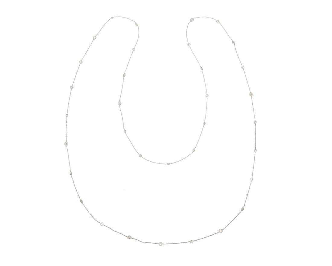A 14K White Gold and Diamond Long Chain: A 14K White Gold and Diamond Long Chain Of a station design featuring round, pear-shaped, triangular-cut, marquise-shaped and heart-shaped diamonds weighing approximately 11.64 carats Length: 62 in.