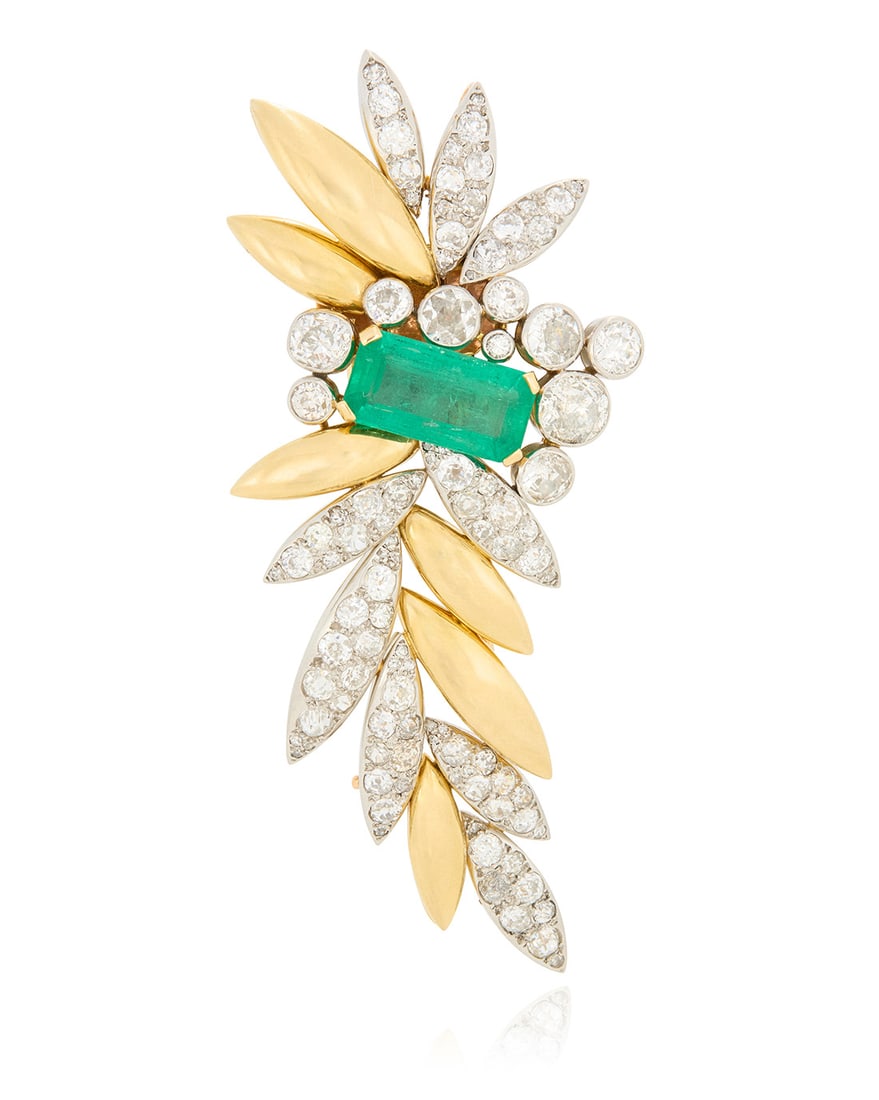 A Bi-Colored Gold, Emerald and Diamond Brooch, French: A Bi-Colored Gold, Emerald and Diamond Brooch, French Of a floral design featuring high polish yellow gold leaves, accented by white gold leaves set with old European-cut and old Mine-cut diamonds
