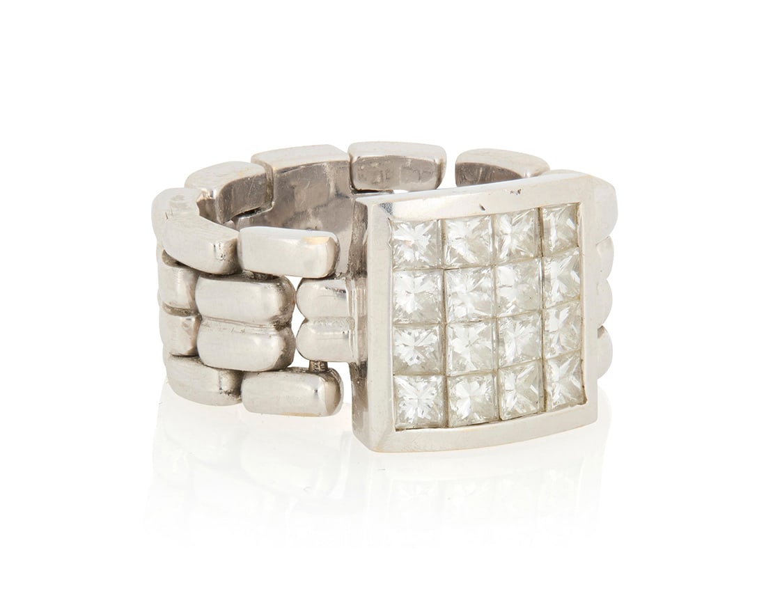 An 18K White Gold and Diamond Ring: An 18K White Gold and Diamond RingOf a chain design centering sixteen princess-cut diamonds weighing approximately 1.60 caratsSize: 7 1/214.4 grams gross