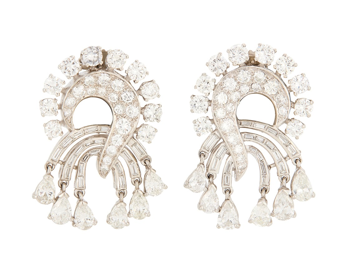 A Pair of Platinum and Diamond Earrings: A Pair of Platinum and Diamond Earrings Of a swirling geometric design set with round and baguette-cut diamonds weighing approximately 6.50 carats 2 pieces Measures: 1 1/4 x 7/8 in. 15.7 grams gross