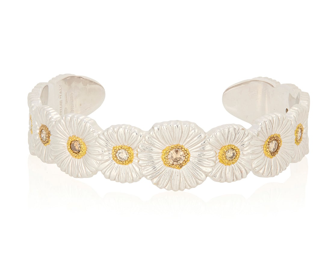 Buccellati: A Sterling Silver, Gold Vermeil and Colored Diamond 'Blossoms Daisy' Cuff: Buccellati: A Sterling Silver, Gold Vermeil and Colored Diamond 'Blossoms Daisy' Cuff Featuring thirteen daisy motifs centering eleven round diamonds weighing approximately 2.20 carats encircled by
